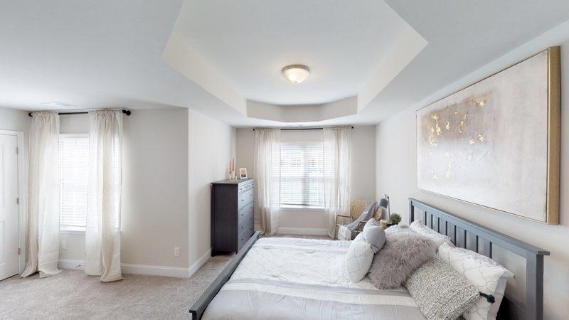 A bedroom in a Benton Woods home