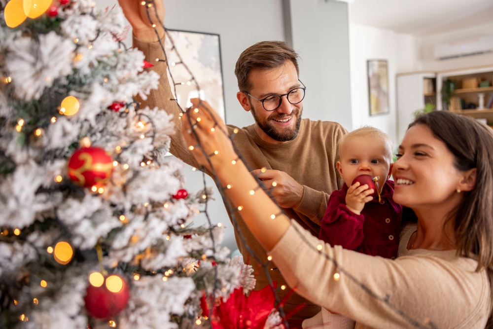 Family Decorating the Christmas Tree ©Impact Photography