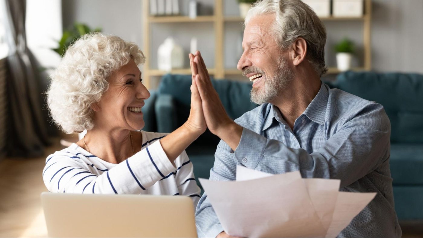 Older Couple Highfiving ©fizkes