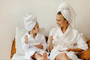 A mom and daughter relaxing in robes
©Evgeny Atamanenko