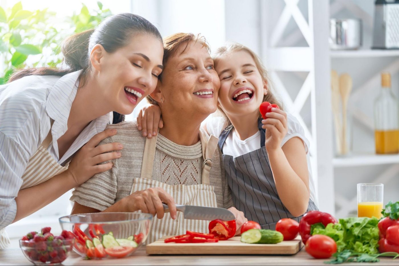 three gen of moms together eating strawberries ©Yuganov Konstantin