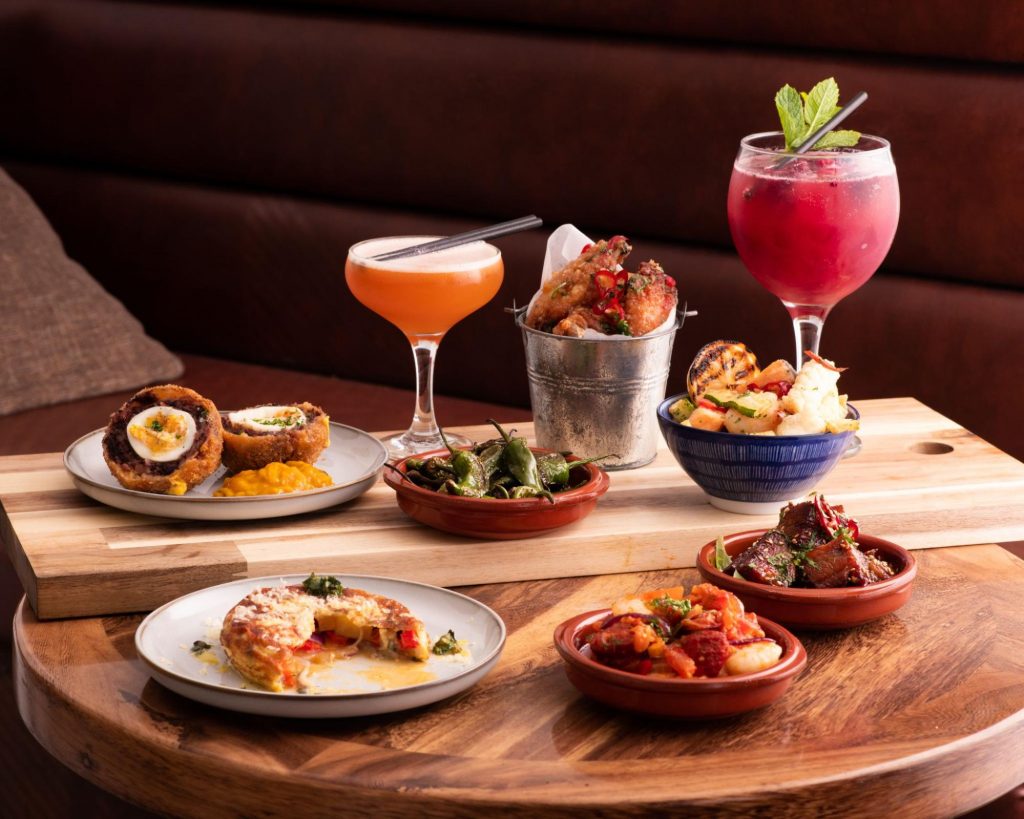 a plate of food and drinks ©Capture House