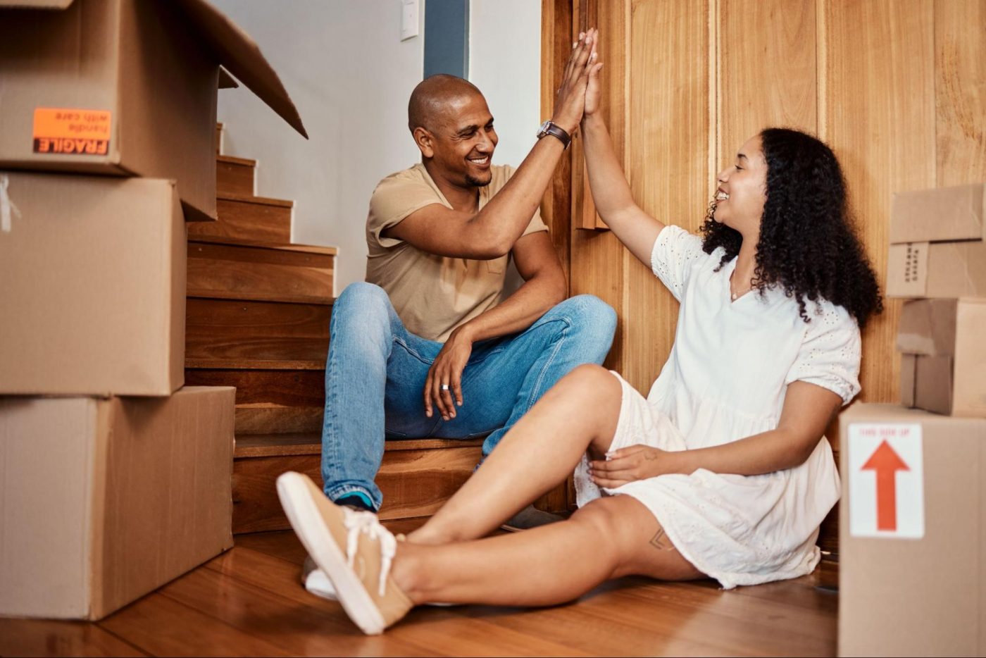Couple moving in to a place with boxes ©PeopleImages.com - Yuri A