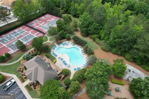 Community pool and tennis courts in The Fairways at Mirror Lake.