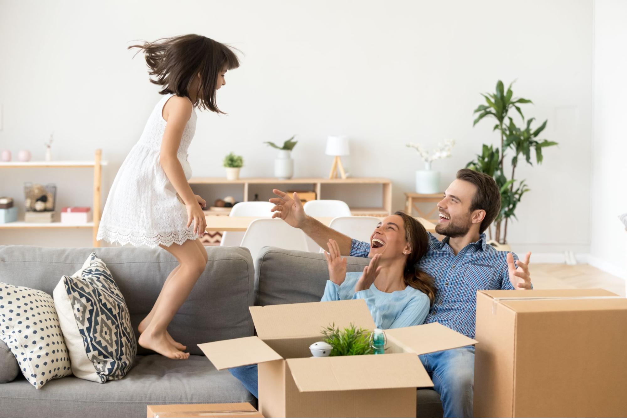 Young family unpacking boxes in the living room of their new Villa Rica home.
©fizkes