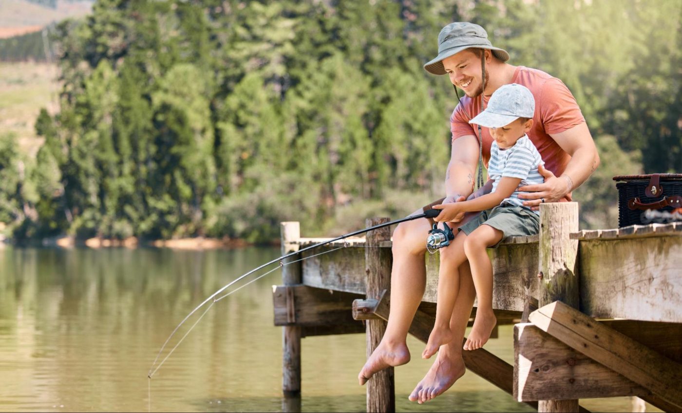 Fishing from a dock at Jackson Lake in Mansfield, GA ©PeopleImages.com - Yuri A