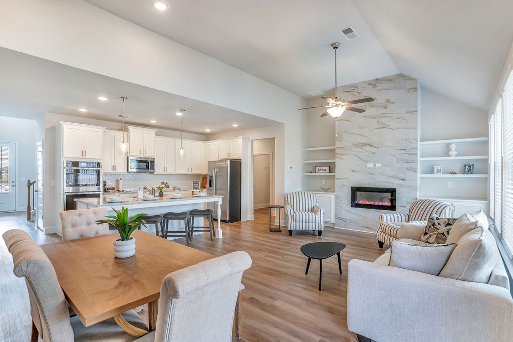 Open kitchen and dining area in a new Peachtree Building Group home