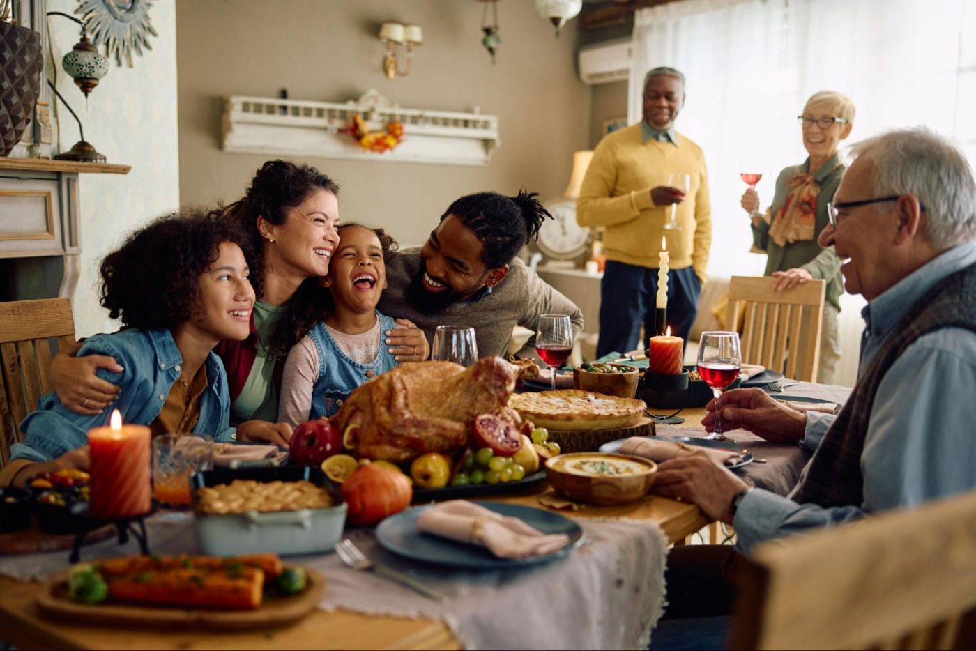 Family enjoying Thanksgiving dinner together in their new home ©Drazen Zigic