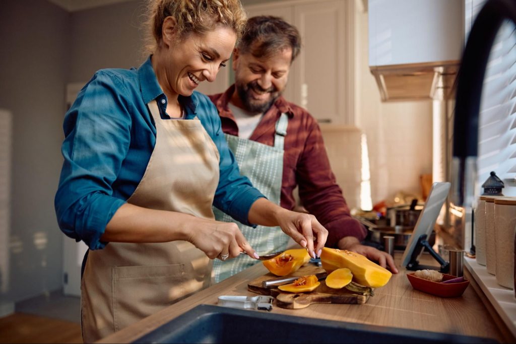 Couple cooking Thanksgiving dinner together in their new kitchen
©Drazen Zigic