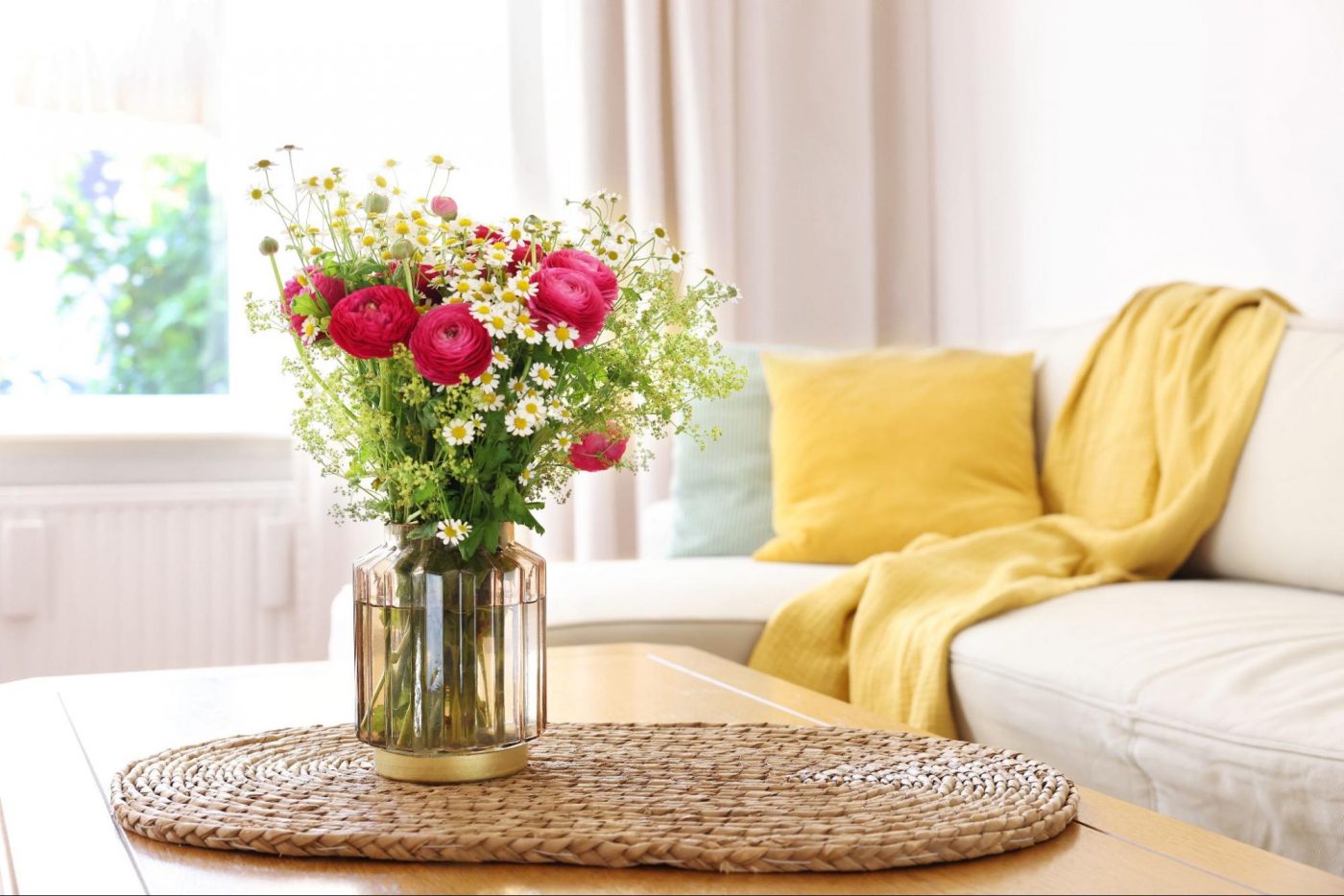 Spring home decor with fresh flowers on a living room coffee table ©New Africa