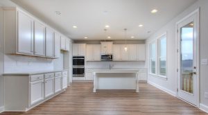 Open kitchen and dining space in a new home in Homer, GA