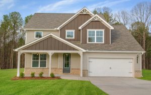  The Fairfield floor plan at Waters Edge, featuring a rocking chair front porch. 