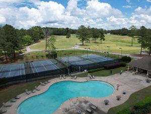 Resort-style swimming pool and tennis courts at the Mirror Lake community in Villa Rica

