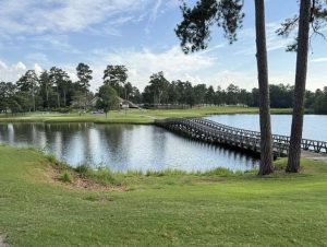 Scenic wooden bridge crossing Mirror Lake at the Mirror Lake Golf and Country Club

