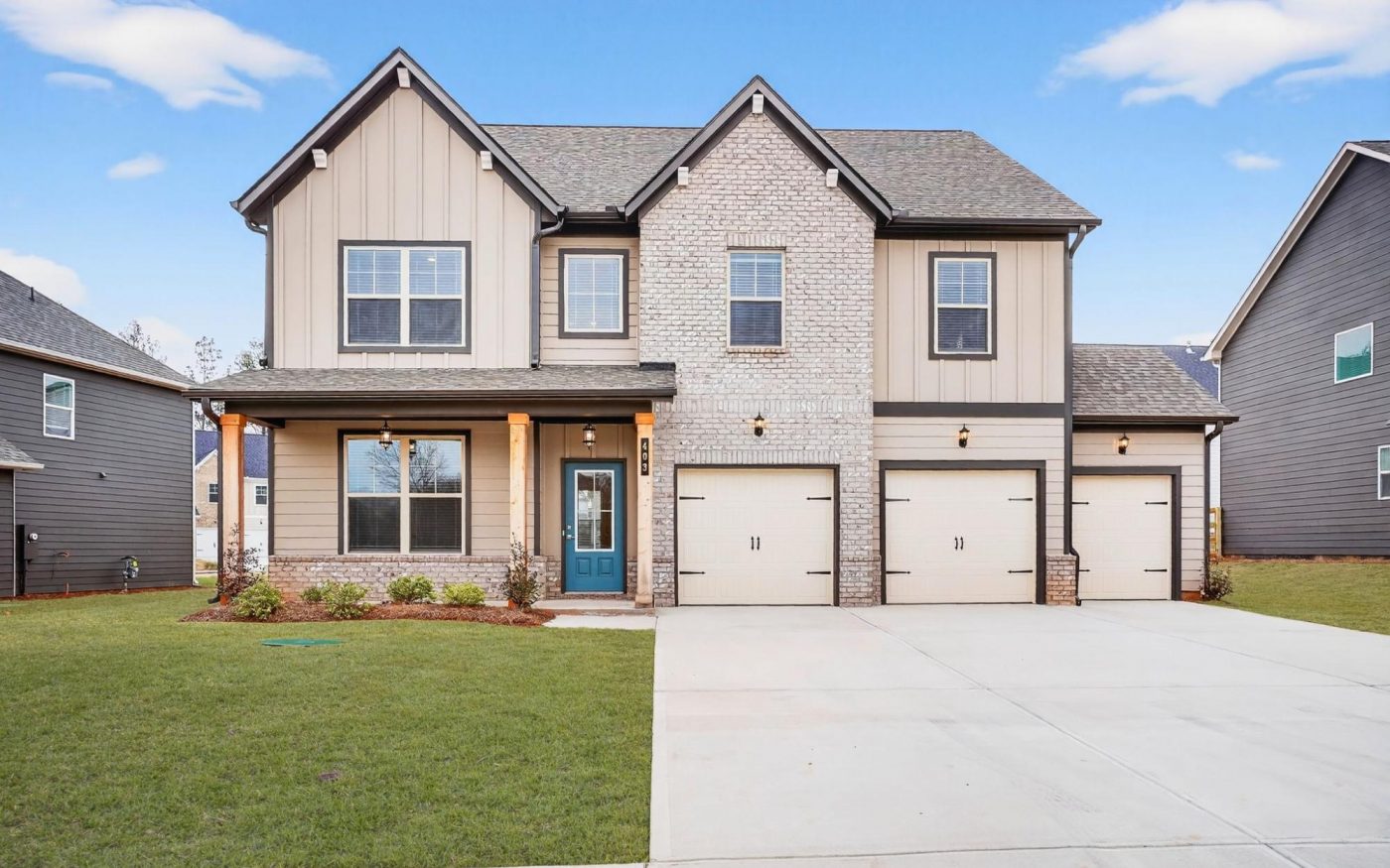 New two-story home with three-car garage at The Fairways at Mirror Lake in Villa Rica, GA