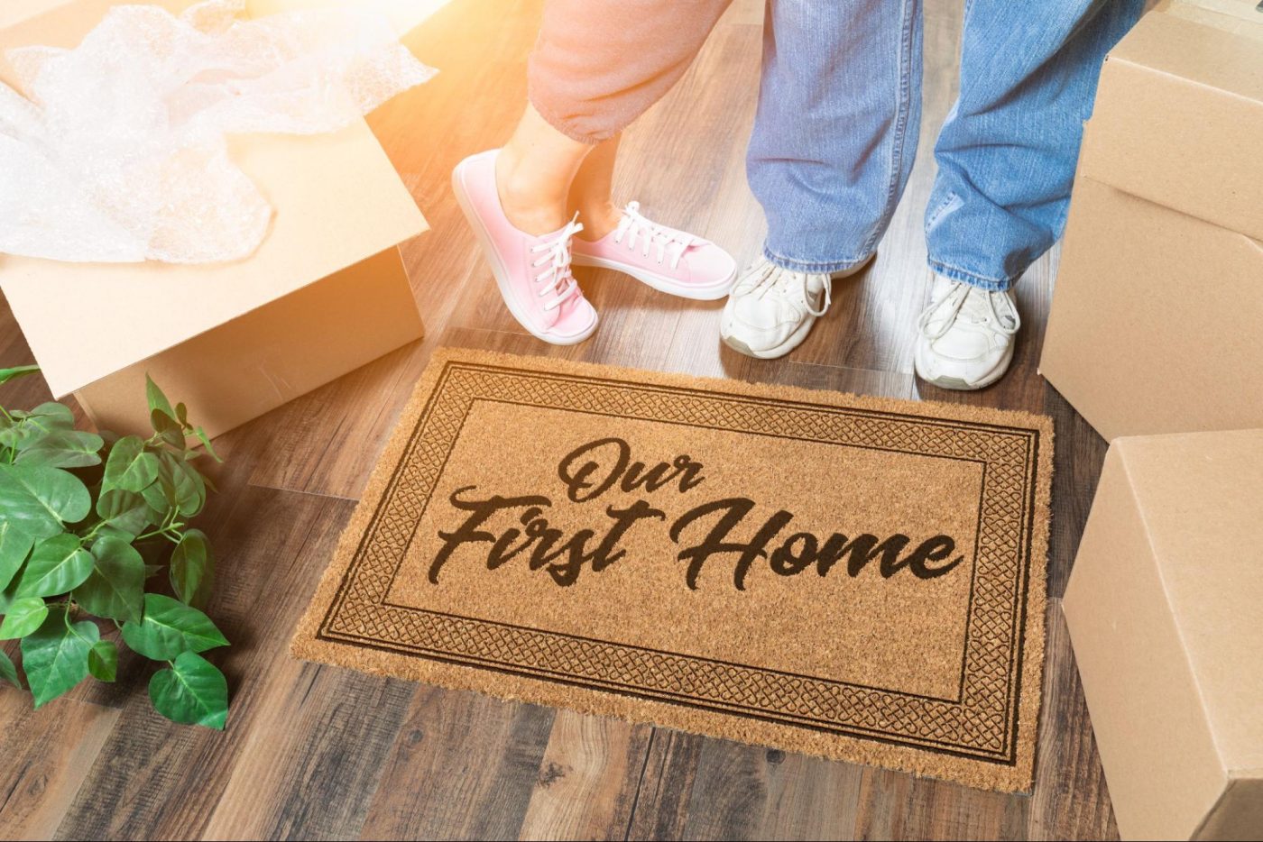 Welcome mat reading Our First Home on dark hardwood floors ©Andy Dean Photography