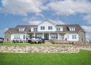 The clubhouse exterior and golf carts at Chimney Oaks Golf Club in Homer, GA