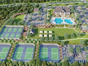 Aerial view of amenities in Gainesville Township, a master-planned community in Georgia featuring a pool, clubhouse, and tennis courts.