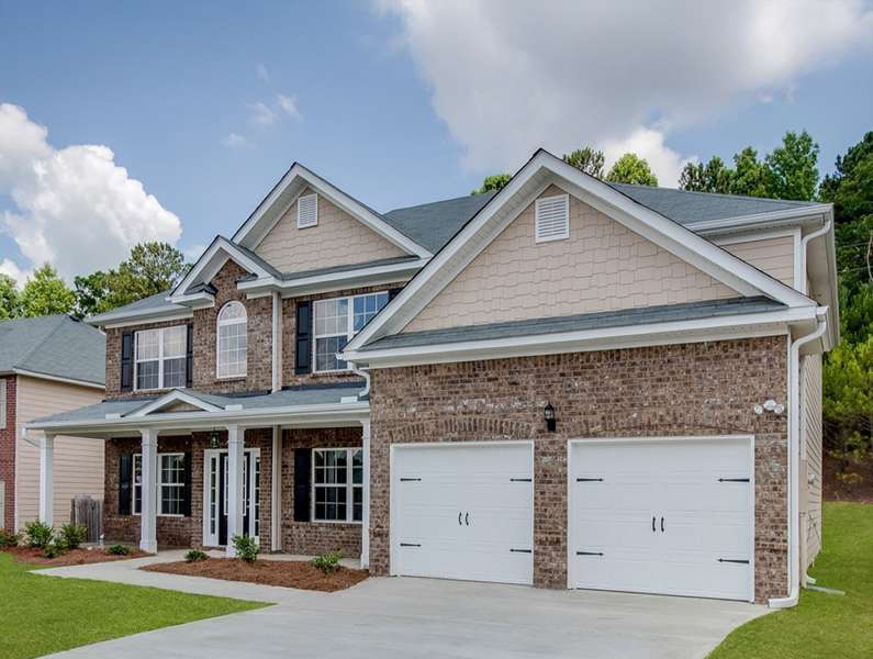two-story family home featuring brick and vinyl siding